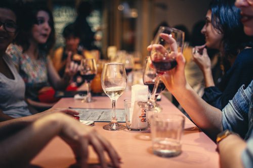 group of women friends drinking at restaurant