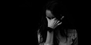 black and white image of sad woman