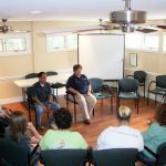 several people sitting in circle - group therapy - English Mountain Recovery