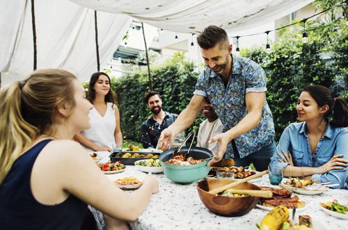 friends having brightly colored dinner outside during the summer - sober summer